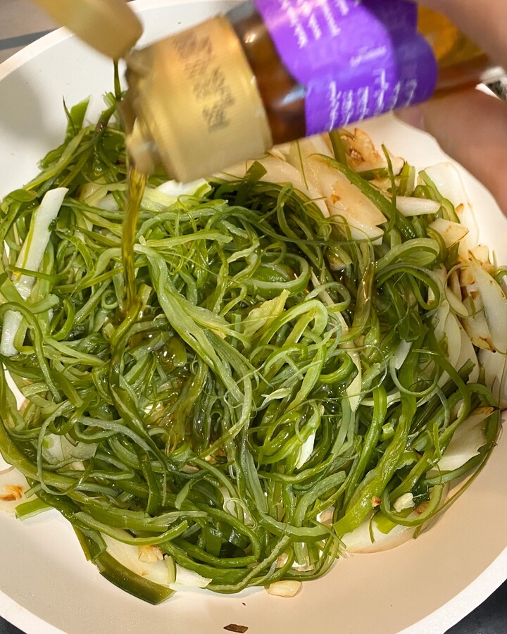 Add sesame oil. Saute for another 5 minutes. And then add soy sauce, sugar.
