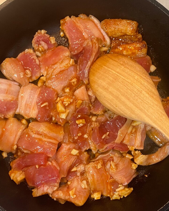 Heat a skillet over high heat and add some cooking oil. When a skillet is hot, add the belly pork in a single layer. Cook it until it’s getting brown. Flip belly pork and let them cook for 2 minutes. And then you make a stir-fry until cooked through and the sauce is sticky.