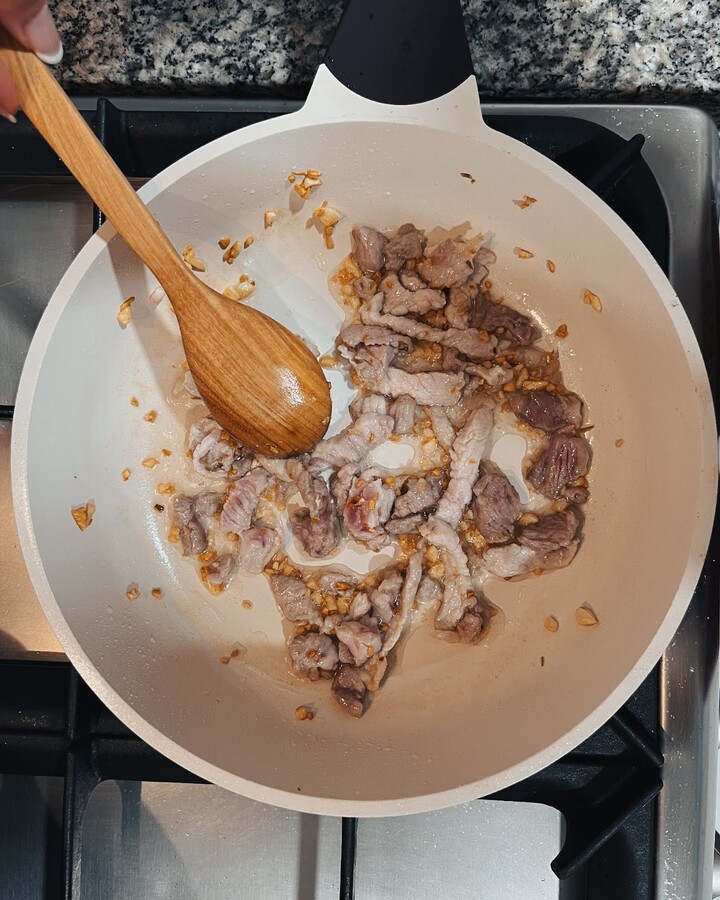 Next, add the pork to the pan and stir until it is fully cooked. Once the pork is cooked, set it aside in the pan.