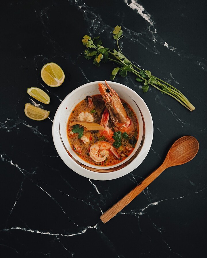 Turn the heat down and stir in lime juice. Top the soup with chopped spring onion and cilantro before serving.