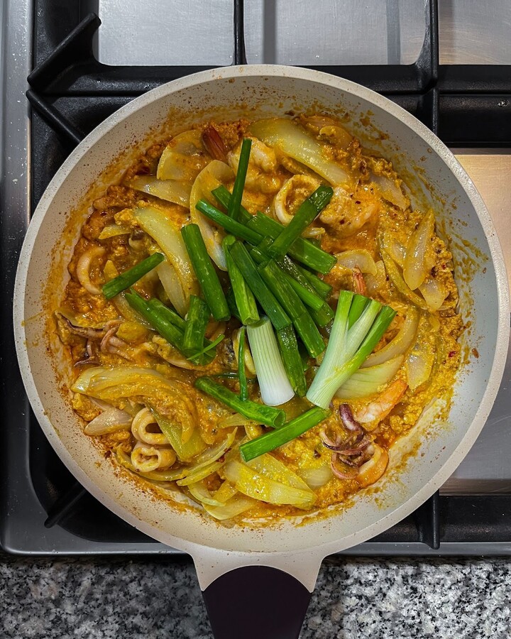 Add finely chopped green onion to the mixture.
