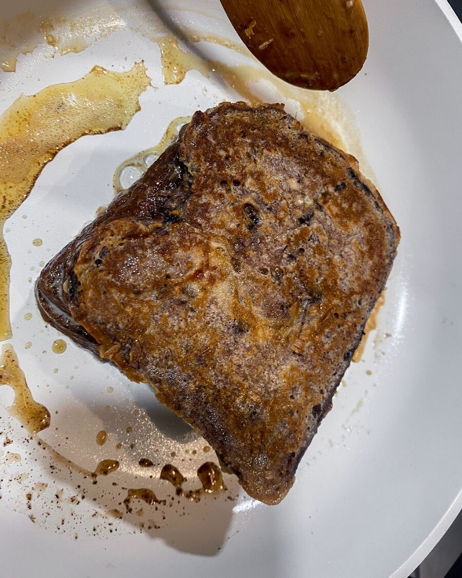 Melt some butter in a pan over medium-high heat, and then fry the soaked bread for about 3 minutes or until it turns golden brown.
