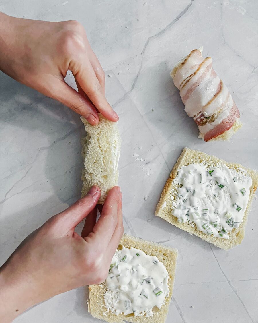Roll up each slice of bread.