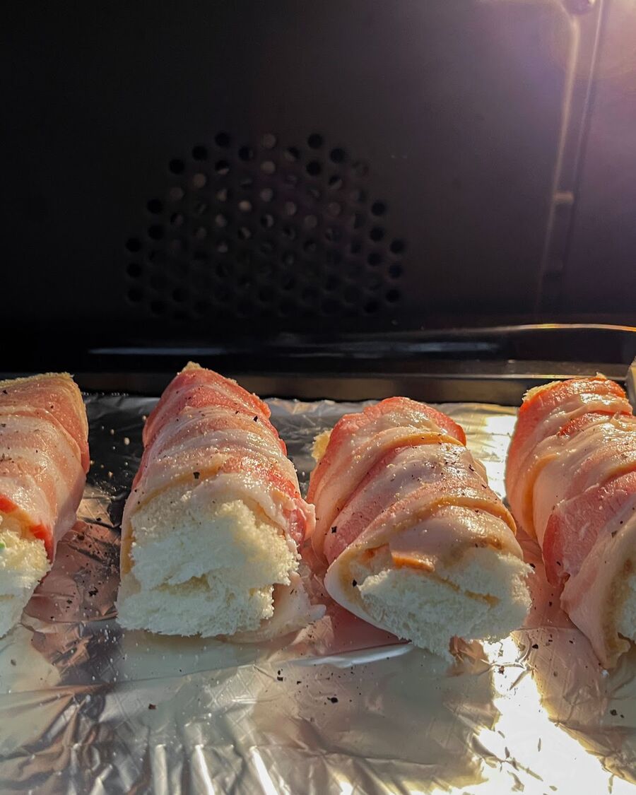 Pop them on a baking sheet and slide them into the oven for 15 minutes. Flip them over for an additional 10 minutes to ensure the bacon is cooked to perfection.