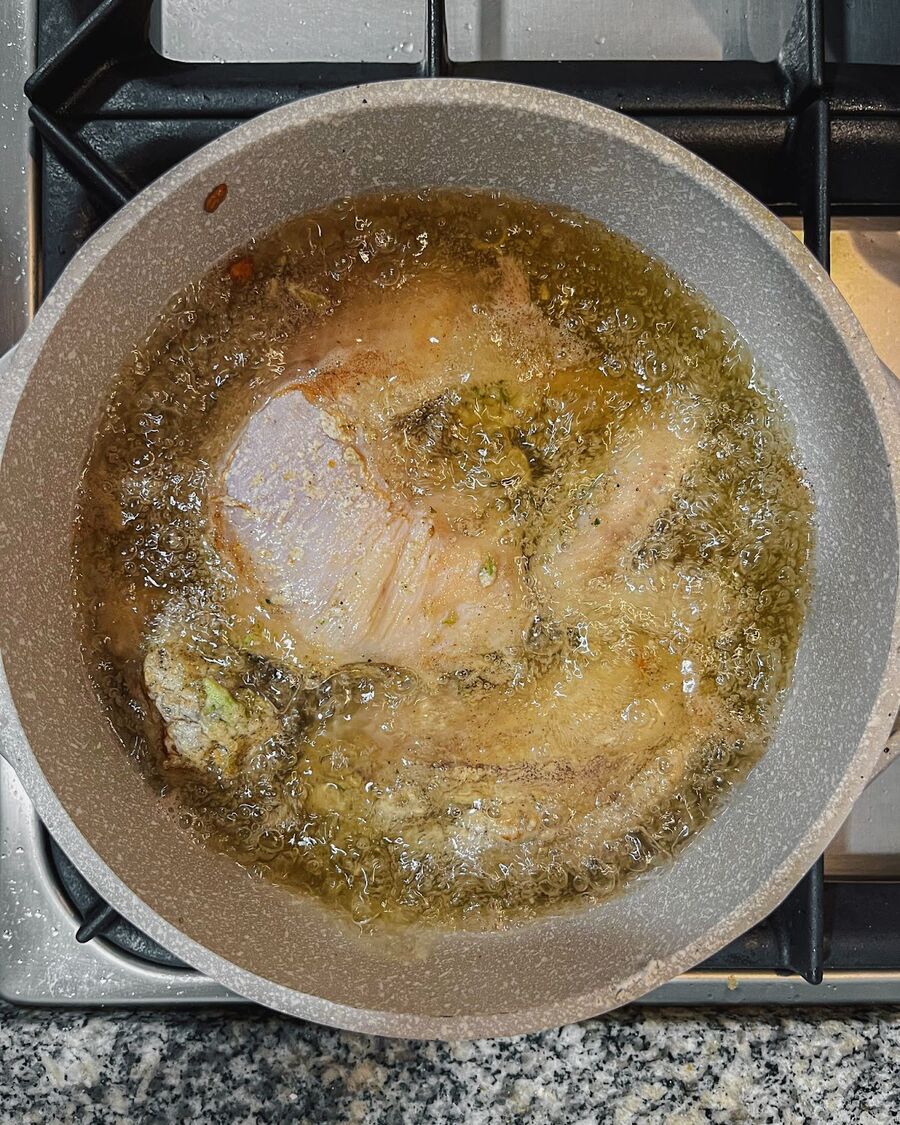 Heat cooking oil to high heat, about 5-6 inches. Once the oil is hot, add the chicken to the pot.
