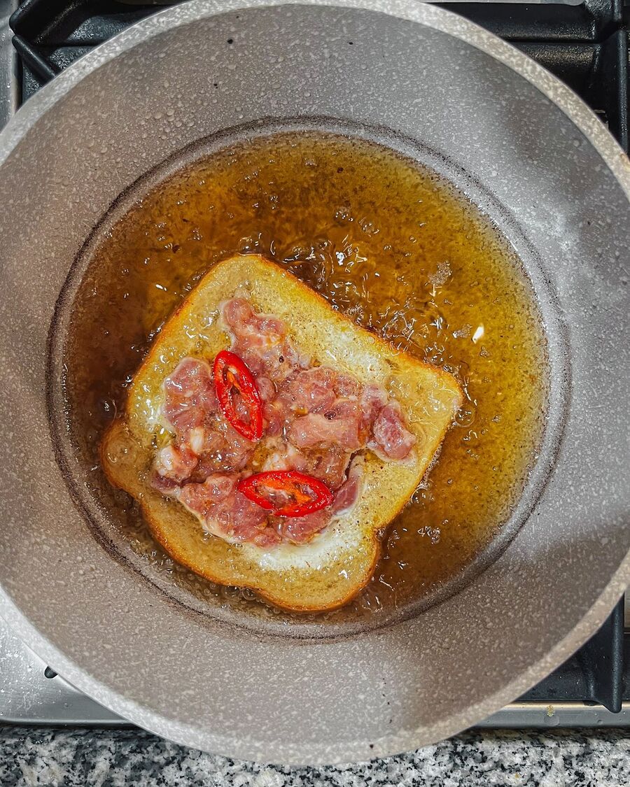 Heat the oil to medium-high heat. Place the bread, egg side down, first until the bread becomes golden brown.
