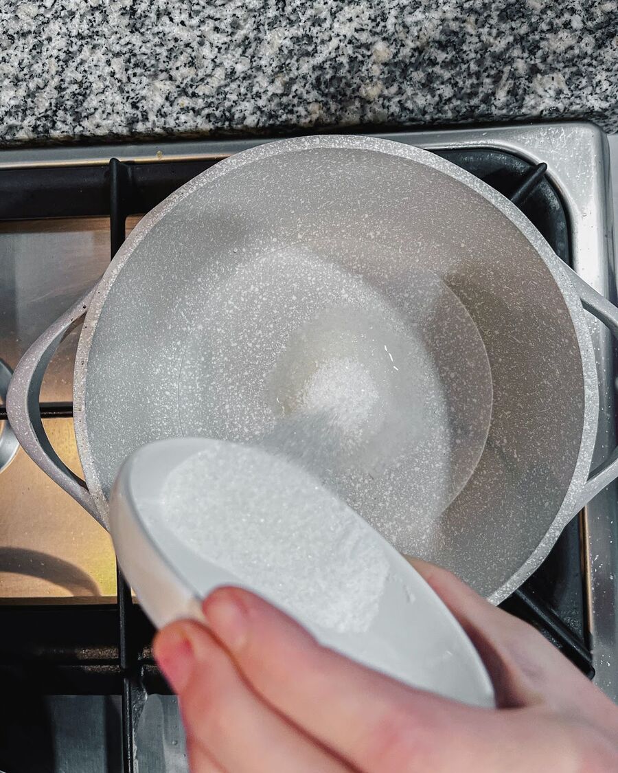 Heat a saucepan over medium-low heat. Pour in the water, vinegar, sugar, and salt, and stir until they are fully dissolved. 