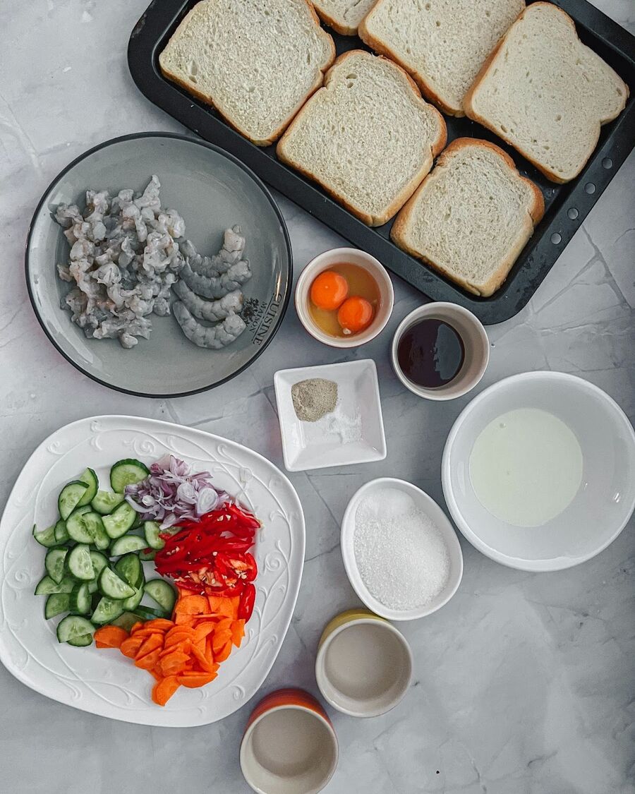 Start by gathering all the ingredients. Let The bread sit outside the plastic bag for around 20 minutes to allow it to dry before cooking.