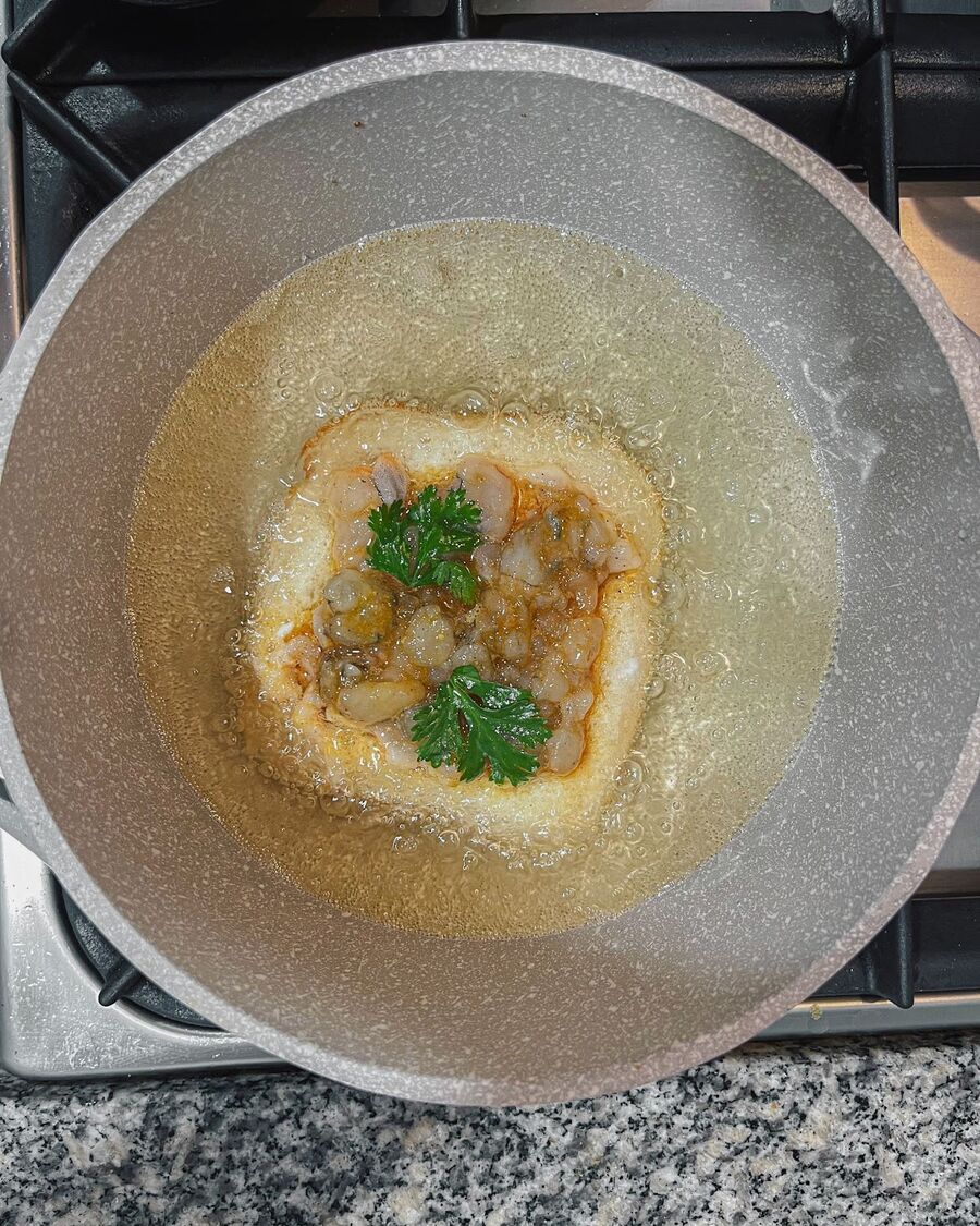 Heat the oil over medium-high heat, then add the bread without the shrimp mixture and fry until golden brown, which should take approximately one minute.