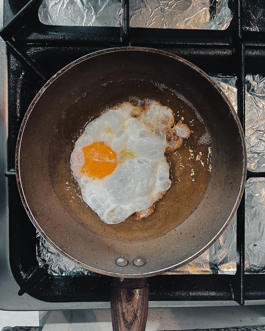 Heat up the oil in a small, high-heat pan until it reaches a depth of approximately 1 inch. Carefully crack the egg into the oil and fry them one at a time until cooked to perfection.
