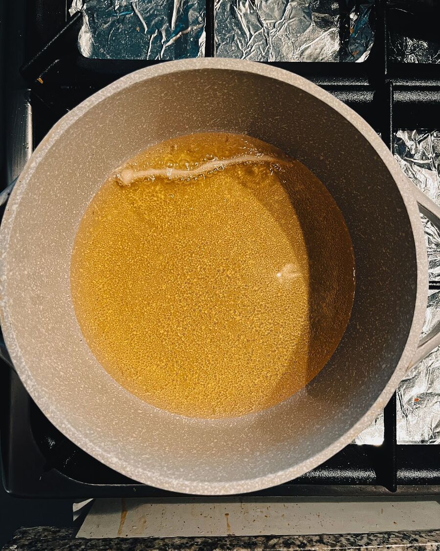 Pour about 1-2 inches of cooking oil into a pan and heat it over medium-high heat. Wait until the oil reaches the proper frying temperature. You can test the oil temperature by dropping in one mushroom - if it begins to sizzle and bubble, the oil is ready for cooking.