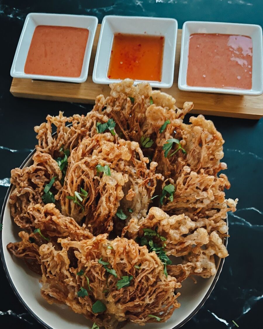 Serve the Fried Enoki Mushroom with Sriracha Mayo and Thai sweet chili sauce as a dipping sauce. Enjoy!