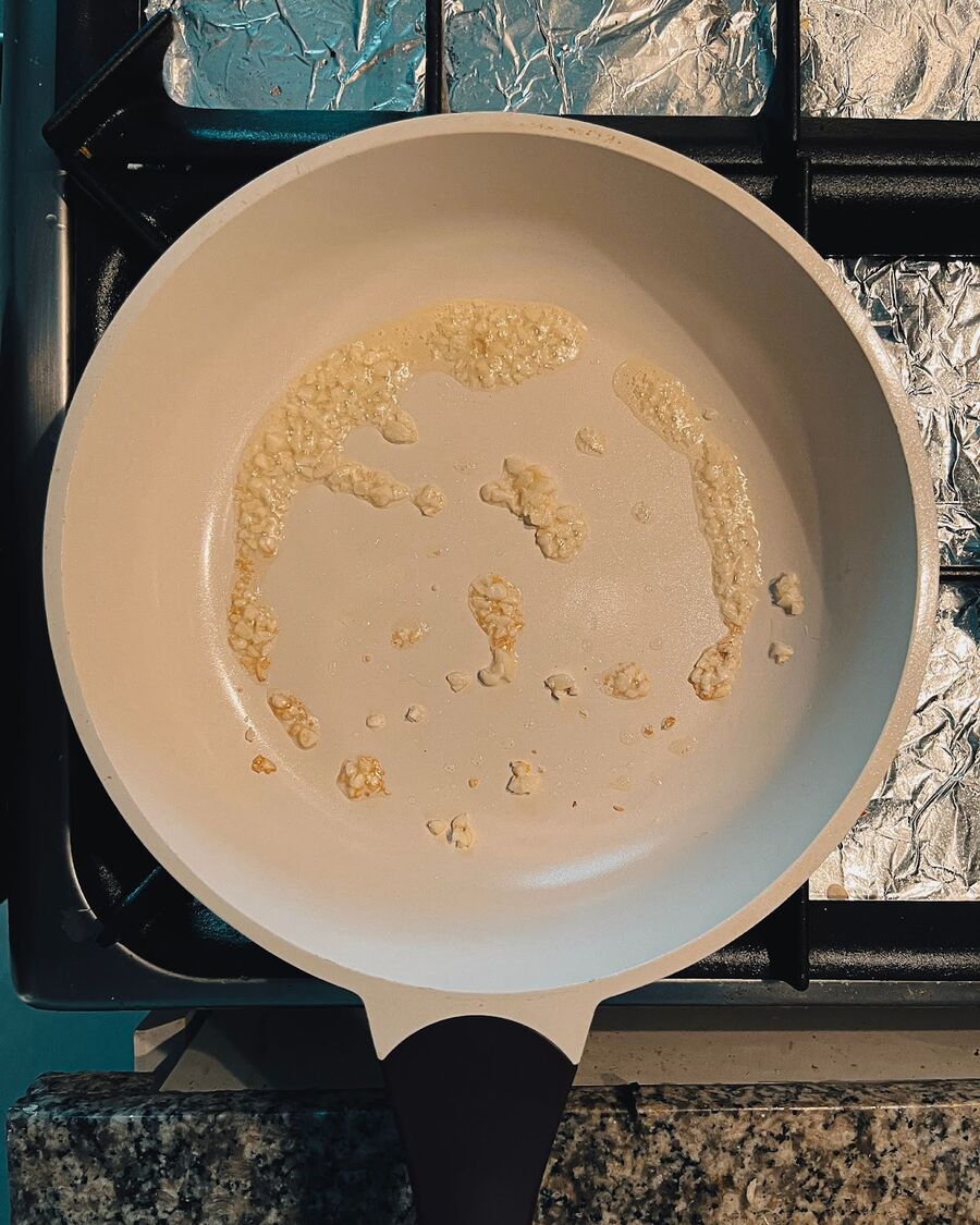 Add approximately one tablespoon of cooking oil to a pan over medium-high heat. Once the oil is hot, add the minced garlic and stir until it becomes fragrant