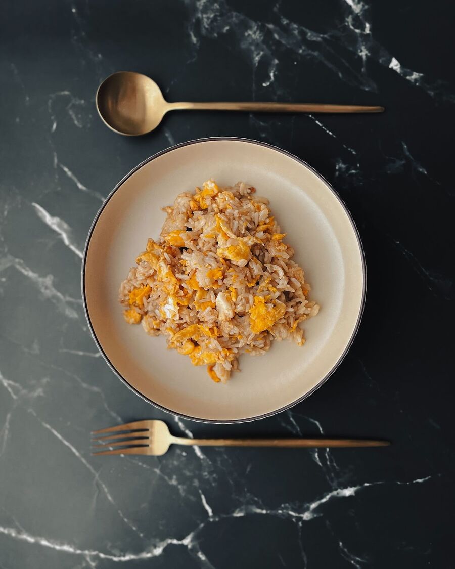 You can serve the egg fried rice as a standalone dish in a bowl, or pair it with your preferred side dish. Enjoy your meal!