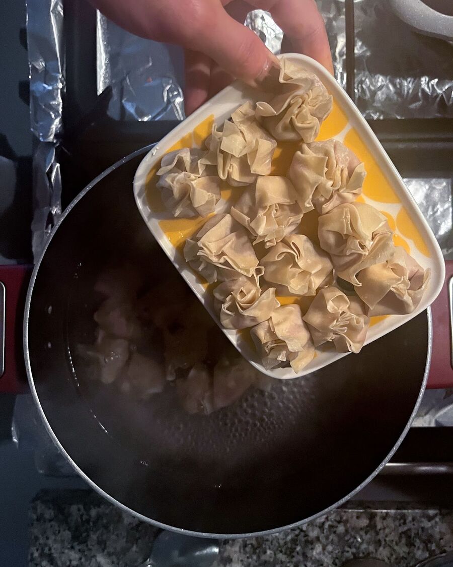 To cook the wontons, first bring a large pot of water to boil. Once the water is boiling, carefully add the wontons and cook for about 3-4 minutes or until they float to the surface. Use a slotted spoon to remove the wontons from the pot and drain the water well. Transfer the cooked wontons to a serving bowl.