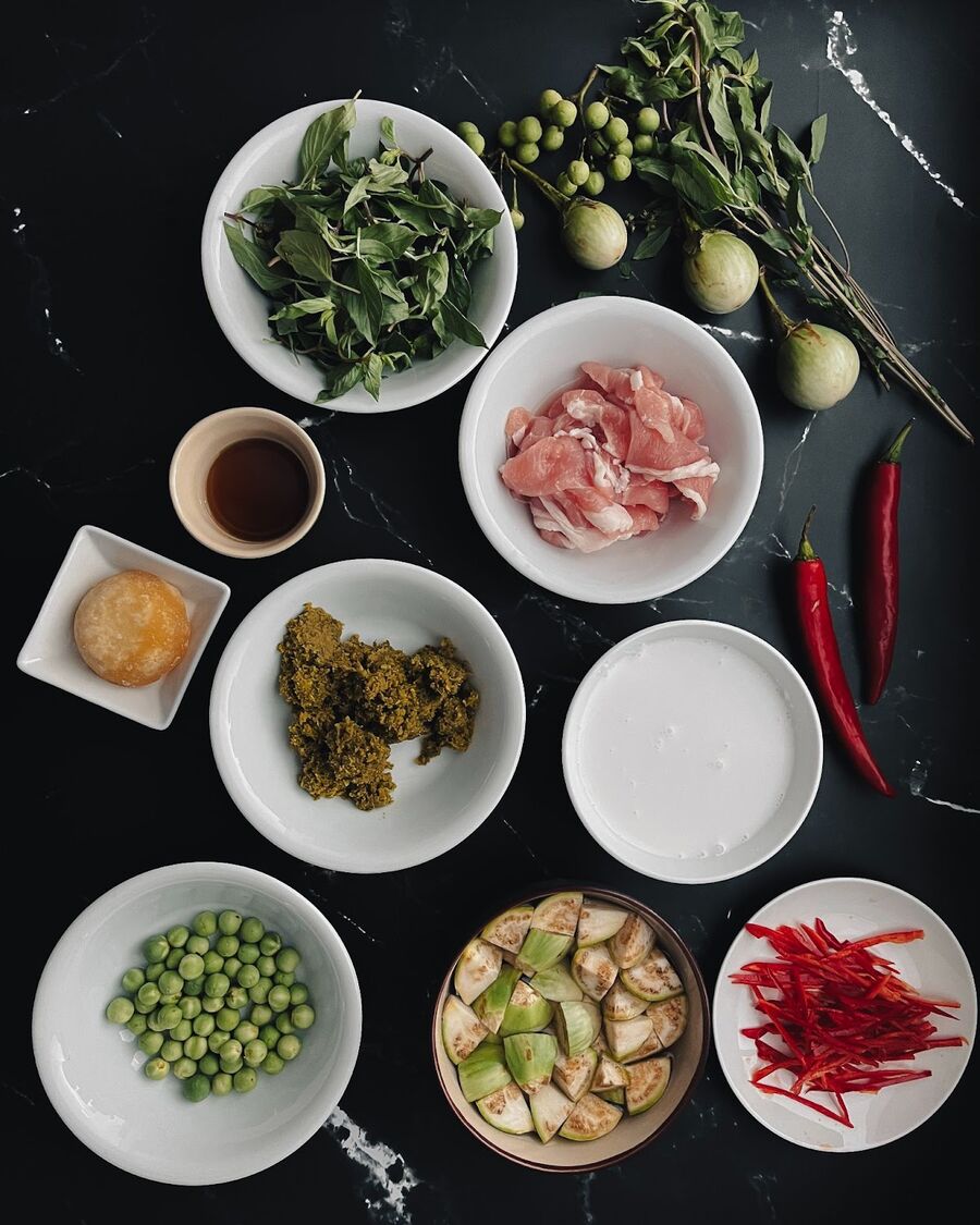 Gather all the essential ingredients for your Thai Green Curry. When it comes to preparing the Thai green eggplants, start by removing the stems and cutting them into bite-sized pieces. To preserve their freshness and prevent them from oxidizing and turning brown prematurely, place the eggplant pieces in a small bowl of water. Soaking them until you're ready to incorporate them into the curry will ensure they remain fresh and vibrant. This helpful tip guarantees that your Thai Green Curry will showcase the eggplants at their best.