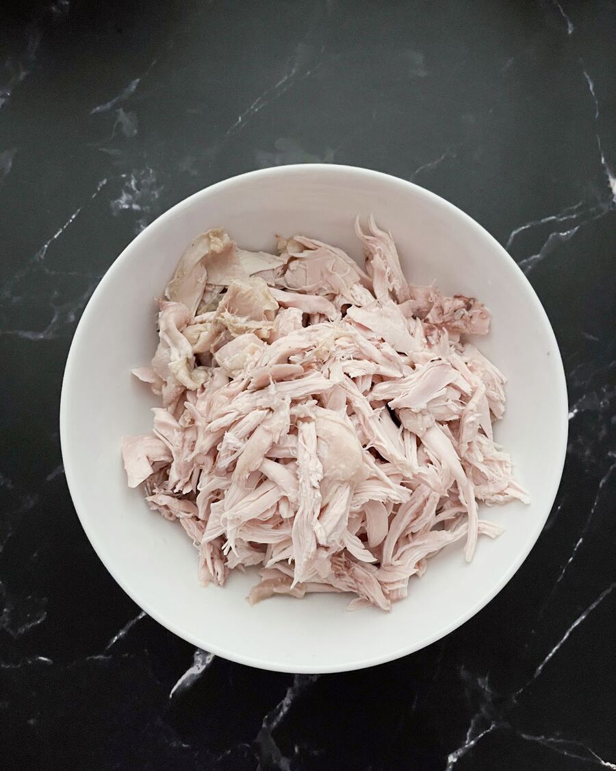 Shred the cooked chicken.