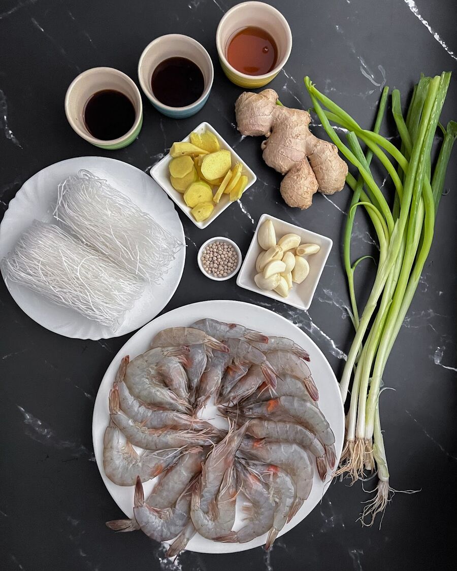 Gather all the essential ingredients and prepare the shrimp. Trim off the shrimp antennas, but leave the head and shell intact to enhance the flavor of your dish.