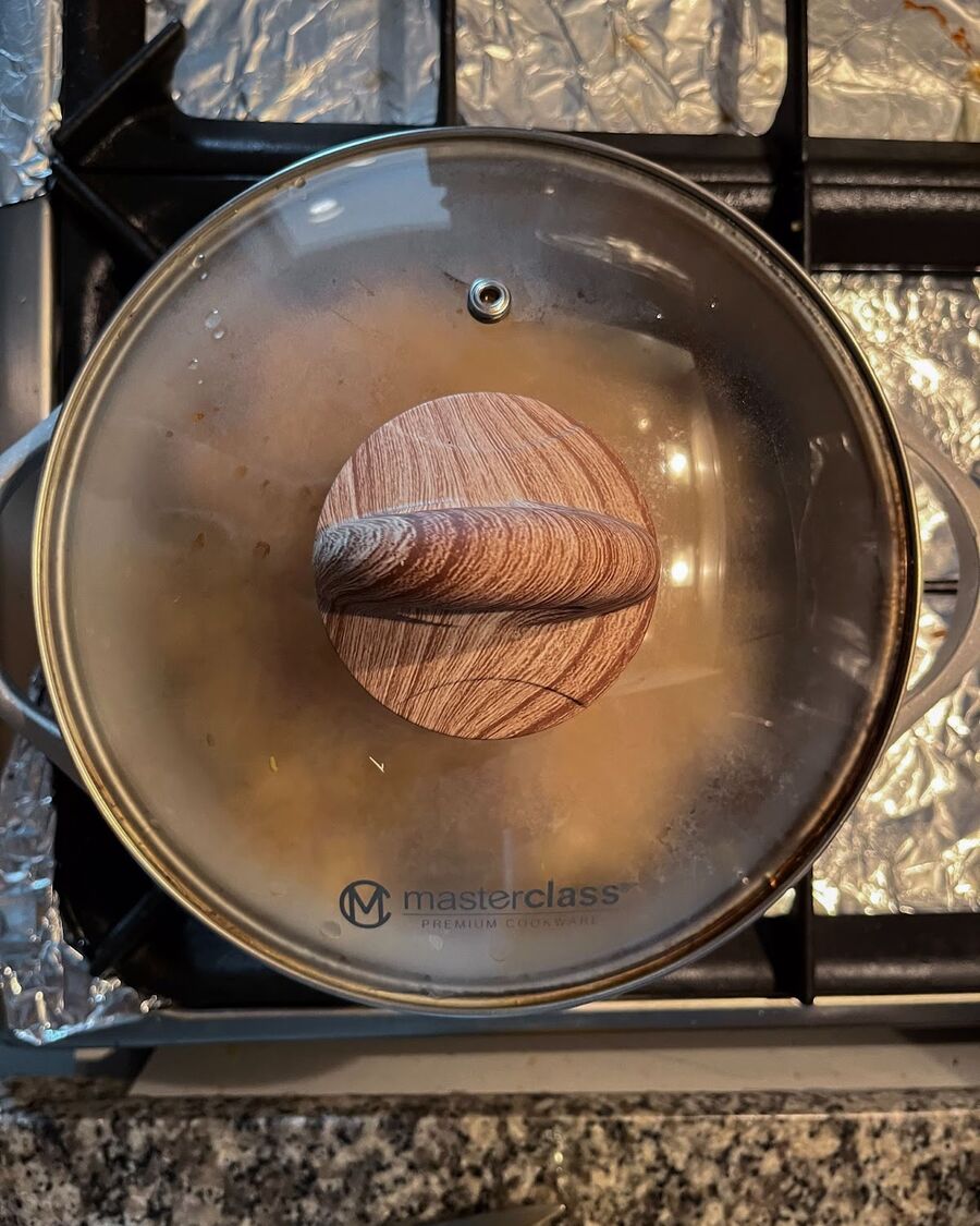 Cover the pot with a lid and cook over medium-low heat for approximately 10 minutes, allowing the ingredients to cook and flavors to meld together.