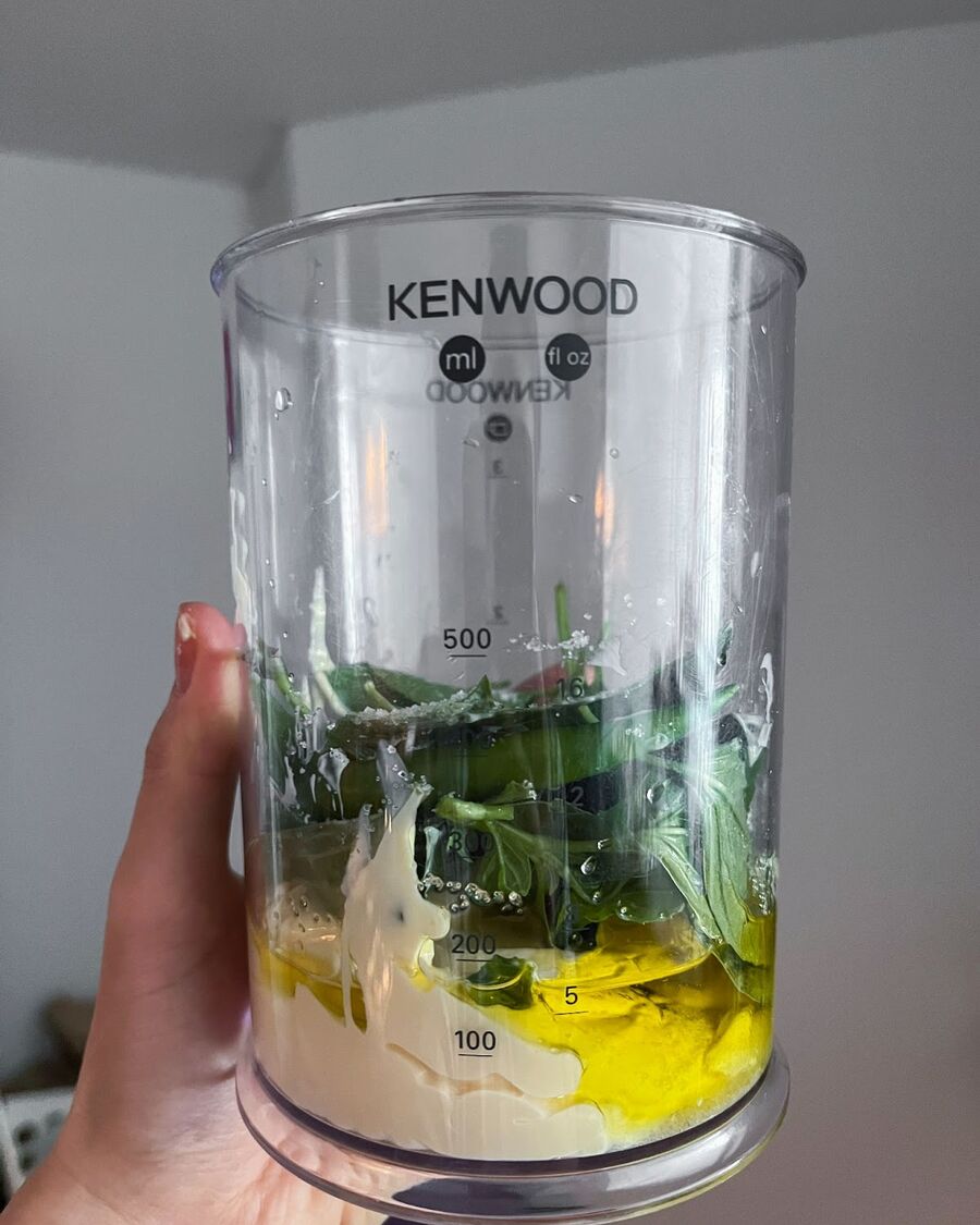 While waiting for the chicken to cook, you can prepare the Thai sweet basil mayo sauce. Simply add Thai sweet basil leaves, mayo, olive oil, salt, fish sauce, sugar, and green chilies to a food processor and blend until well combined.