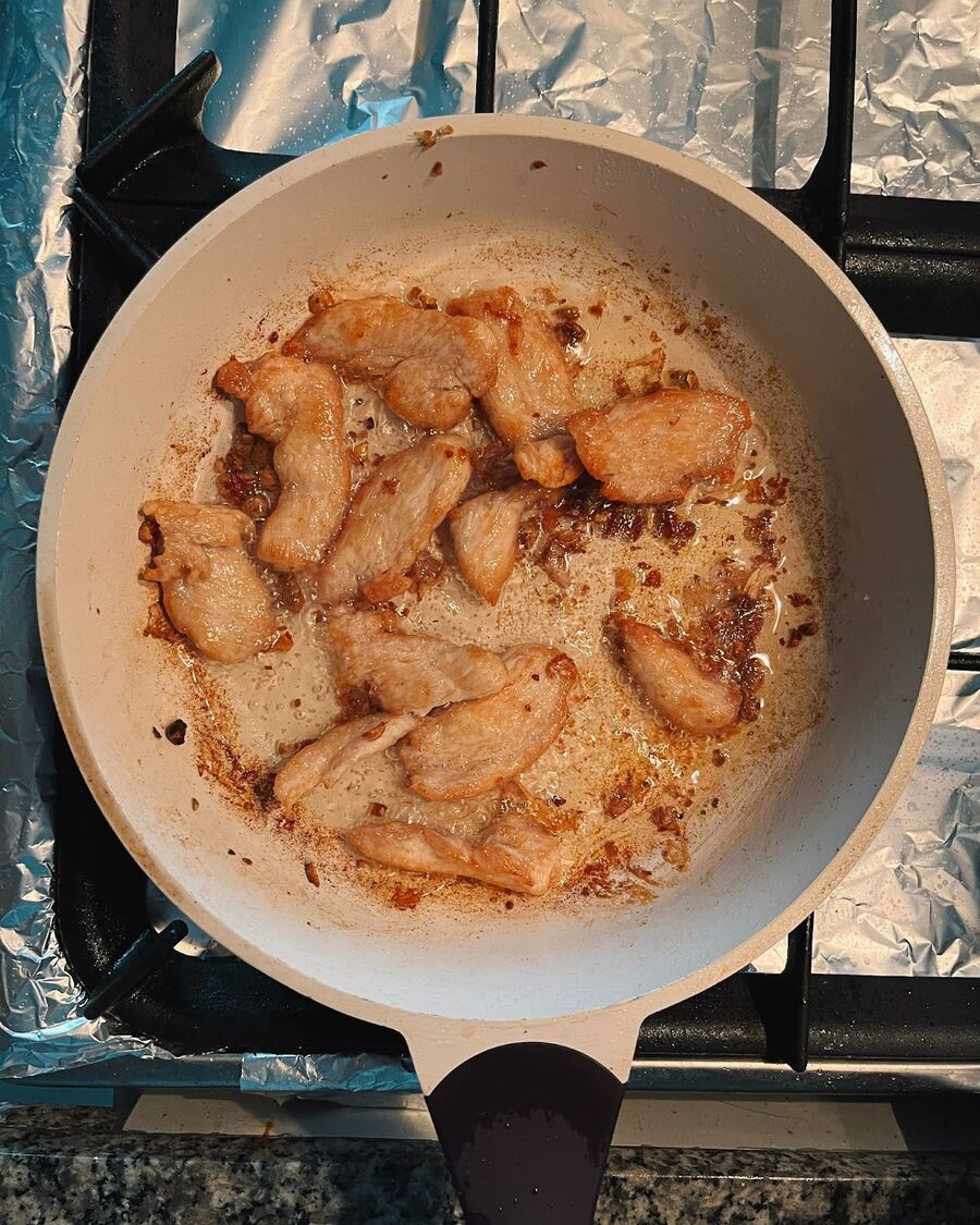 Add the chicken to the pan for deep frying. It will take approximately 8 minutes. Fry the chicken until it is cooked and turns a crunchy golden color. Once cooked, remove the chicken from the pan.