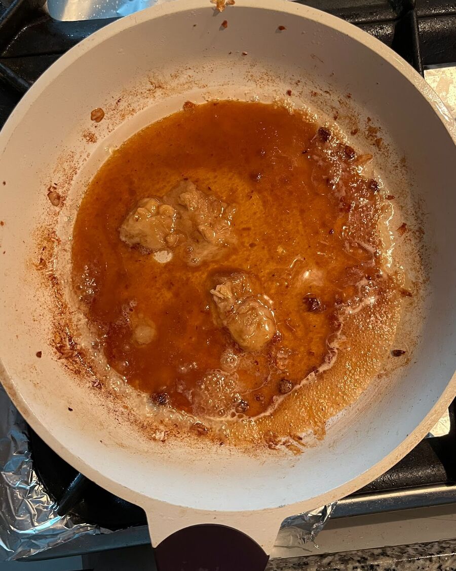 Using the same pan and cooking oil from the deep-fried chicken, add fish sauce, palm sugar, and tamarind paste. Stir them well together until the palm sugar is melted.