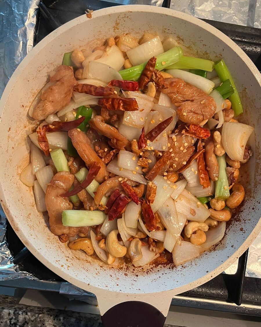 Add as many dried chillies as you like, depending on your desired level of spiciness. Stir continuously.