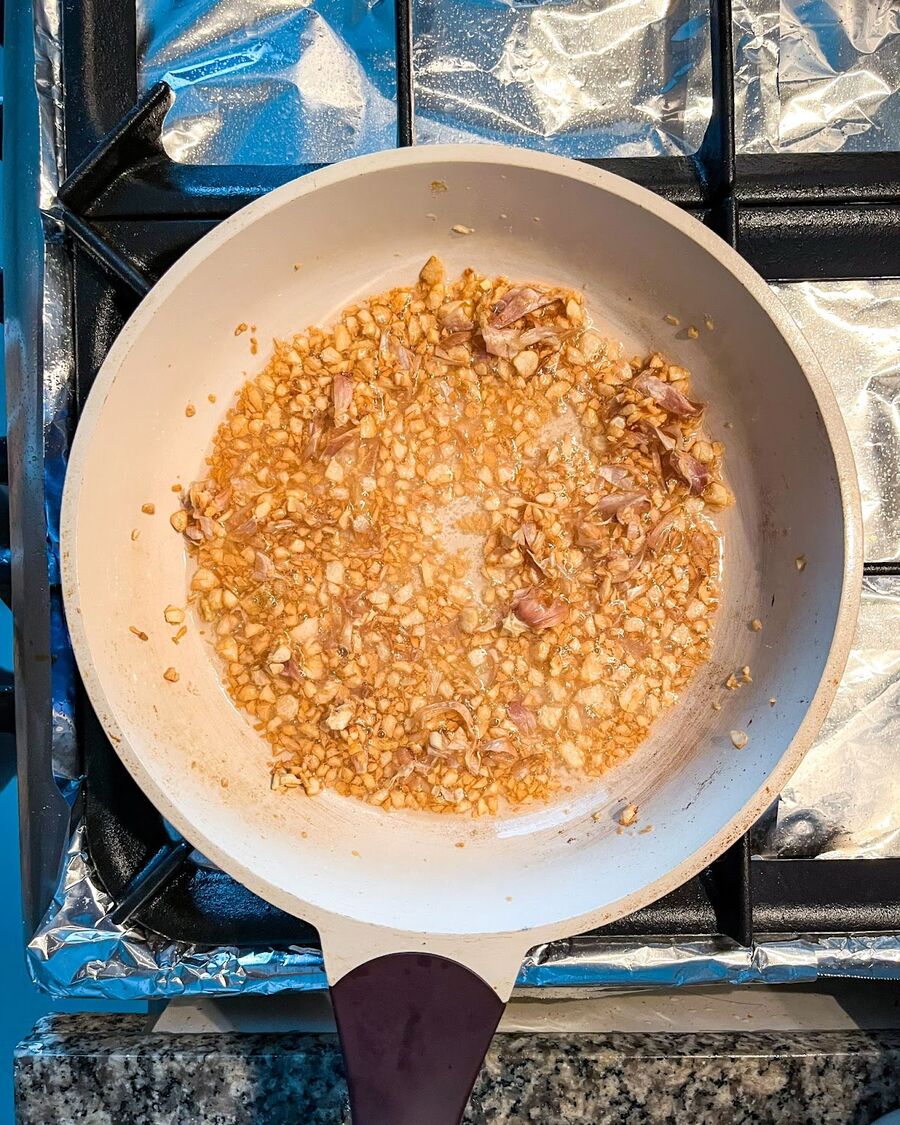 In a small pan, fry the garlic. Heat ¼ cup of cooking oil over medium-high heat. Add the minced garlic and stir continuously until it becomes fragrant and turns slightly golden. Once you achieve this, remove the pan from the heat.