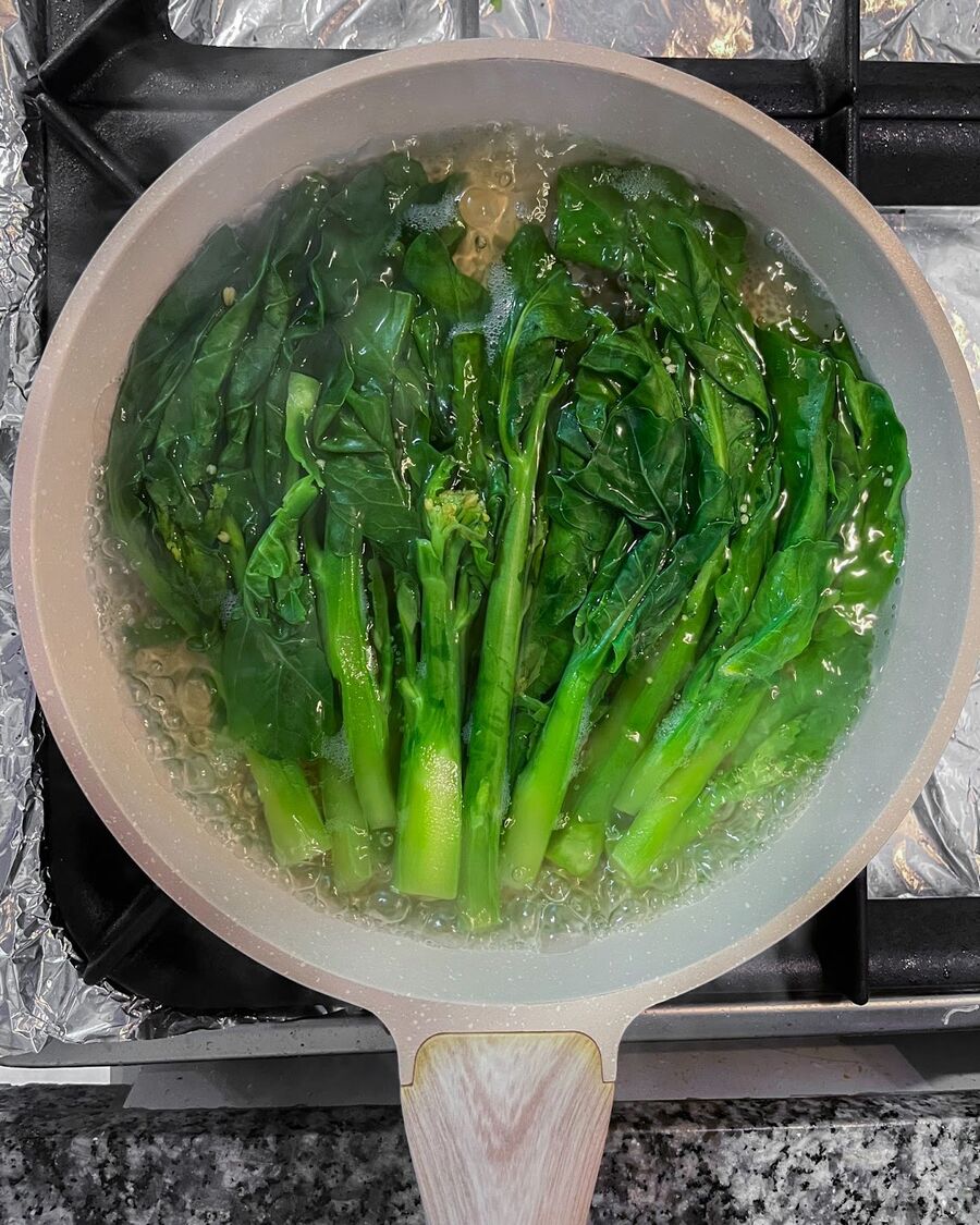 Next, flip the Kailan to the other side and continue cooking for an additional two minutes or until the Kailan is thoroughly cooked.