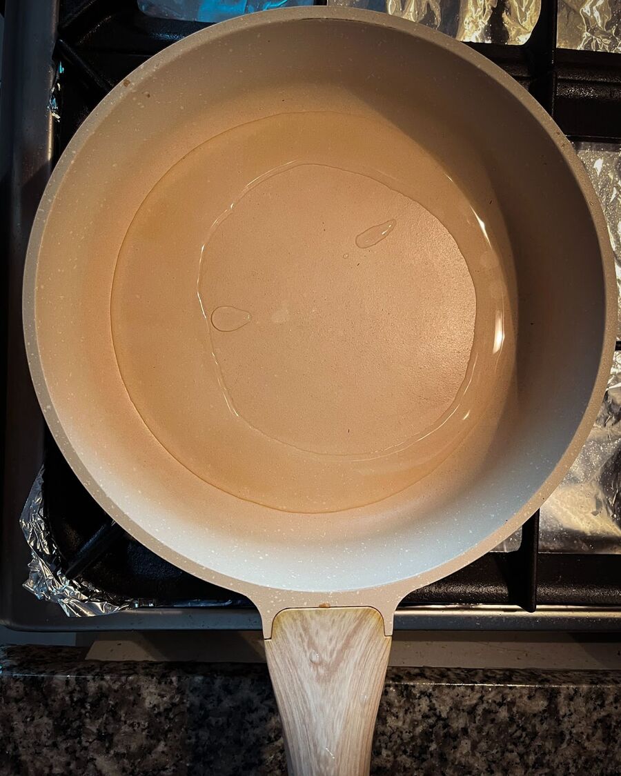 Heat the oil in a pan over medium-high heat until very hot. Look for smoke around the pan, or drop a small amount of the egg mixture from the fork; if it's hot enough, it will splatter and pop.  