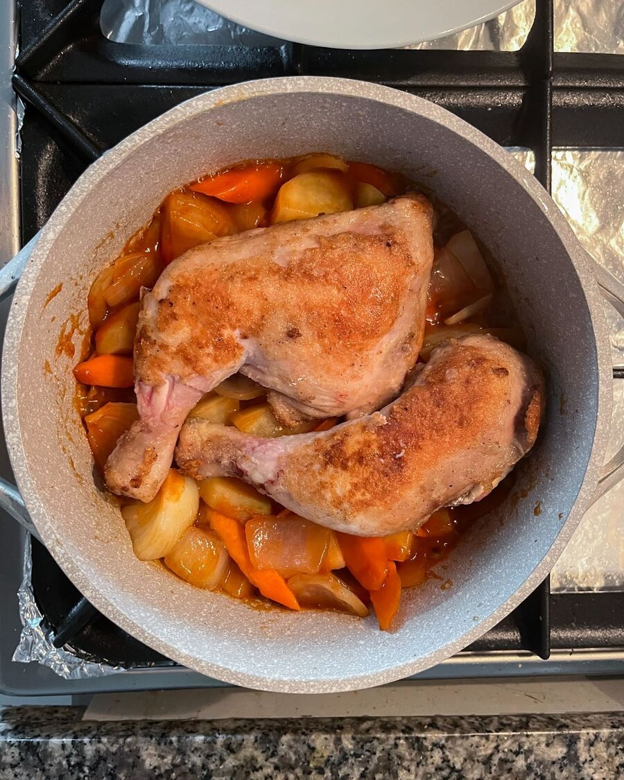 Return the chicken to the pot with the skin side up.