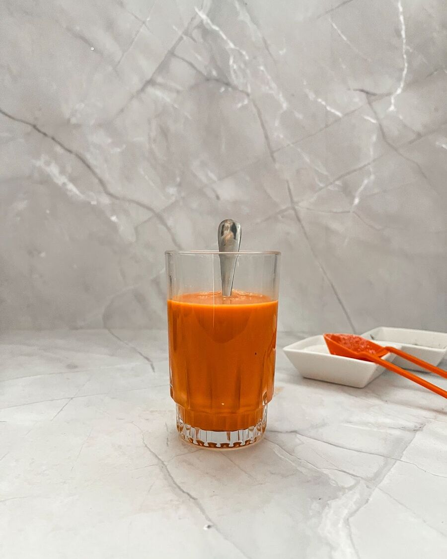 Stir all the ingredients to dissolve. The Thai tea will change to an orange color.