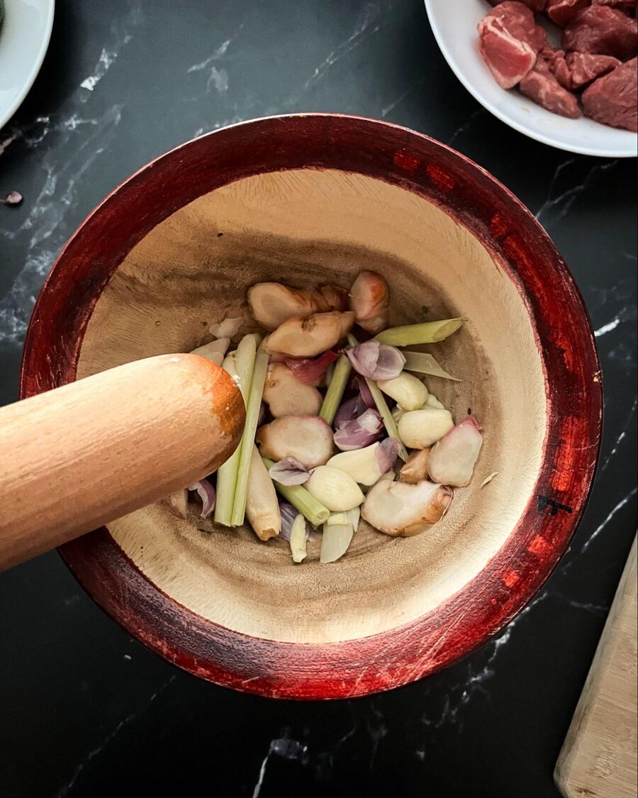 Use a large clay or wooden mortar to crush all of the herb ingredients.