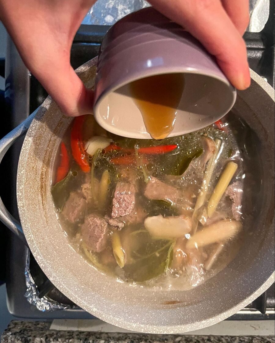 Add fish sauce, palm sugar, and roasted chili flakes. Stir to combine them for about 5 minutes, allowing all the ingredients to infuse the flavors.