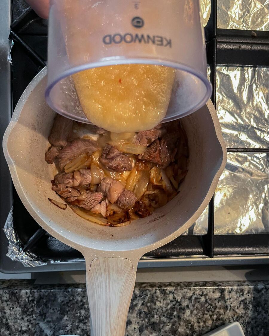 Stir the beef until it cooks, then add the blended apple mixture.