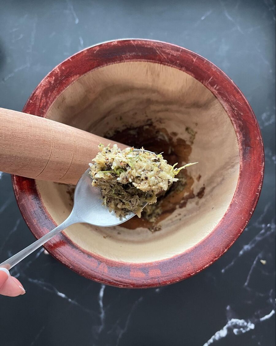 Pound the garlic, cilantro roots, and black pepper until they are thoroughly combined.