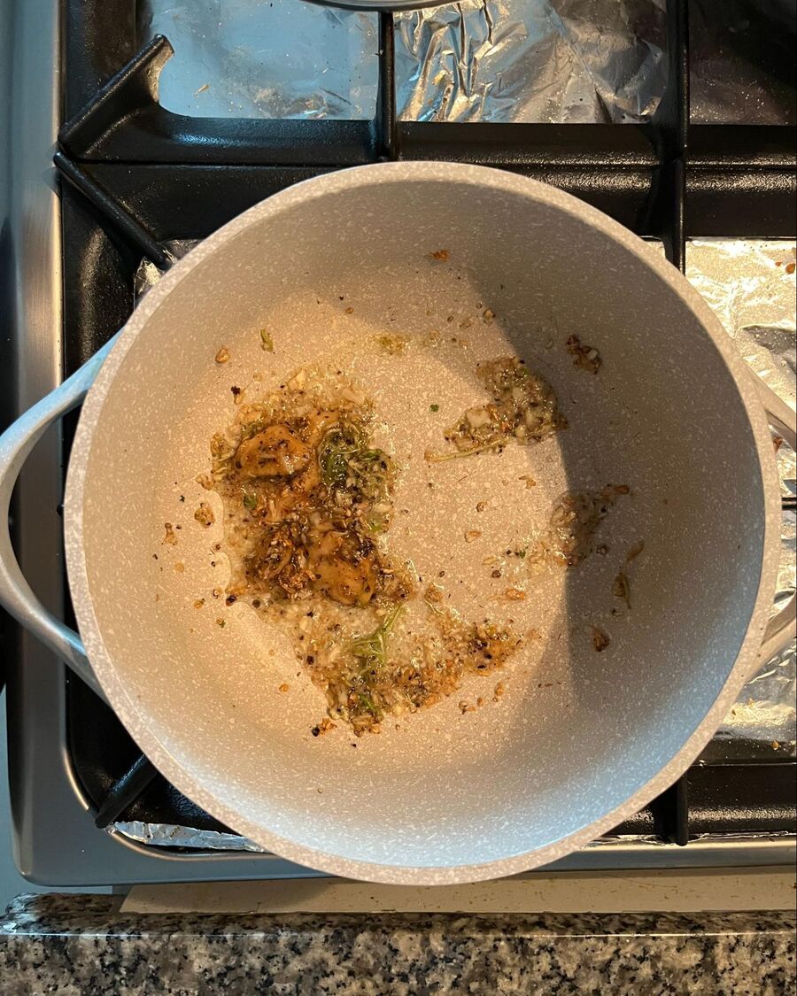 Set a soup pot over medium-high heat. Once it’s hot, add the cooking oil, followed by the garlic and cilantro root mix. Stir until fragrant, then add the palm sugar.