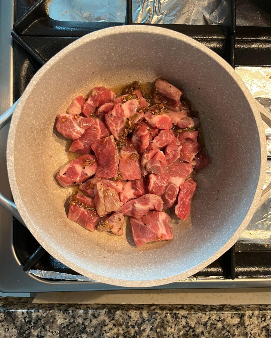 Add the pork belly and stir until it is coated with the sauce.