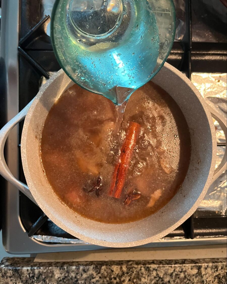 Add 3 cups of water and allow the sauce to simmer for about 5 minutes.