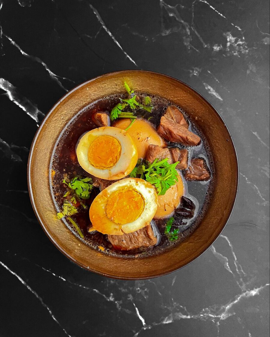 When the meat becomes tender and the eggs turn brown, reduce the heat. Now, you can serve the dish with Jasmine rice and the dish is completed. Congratulations!
