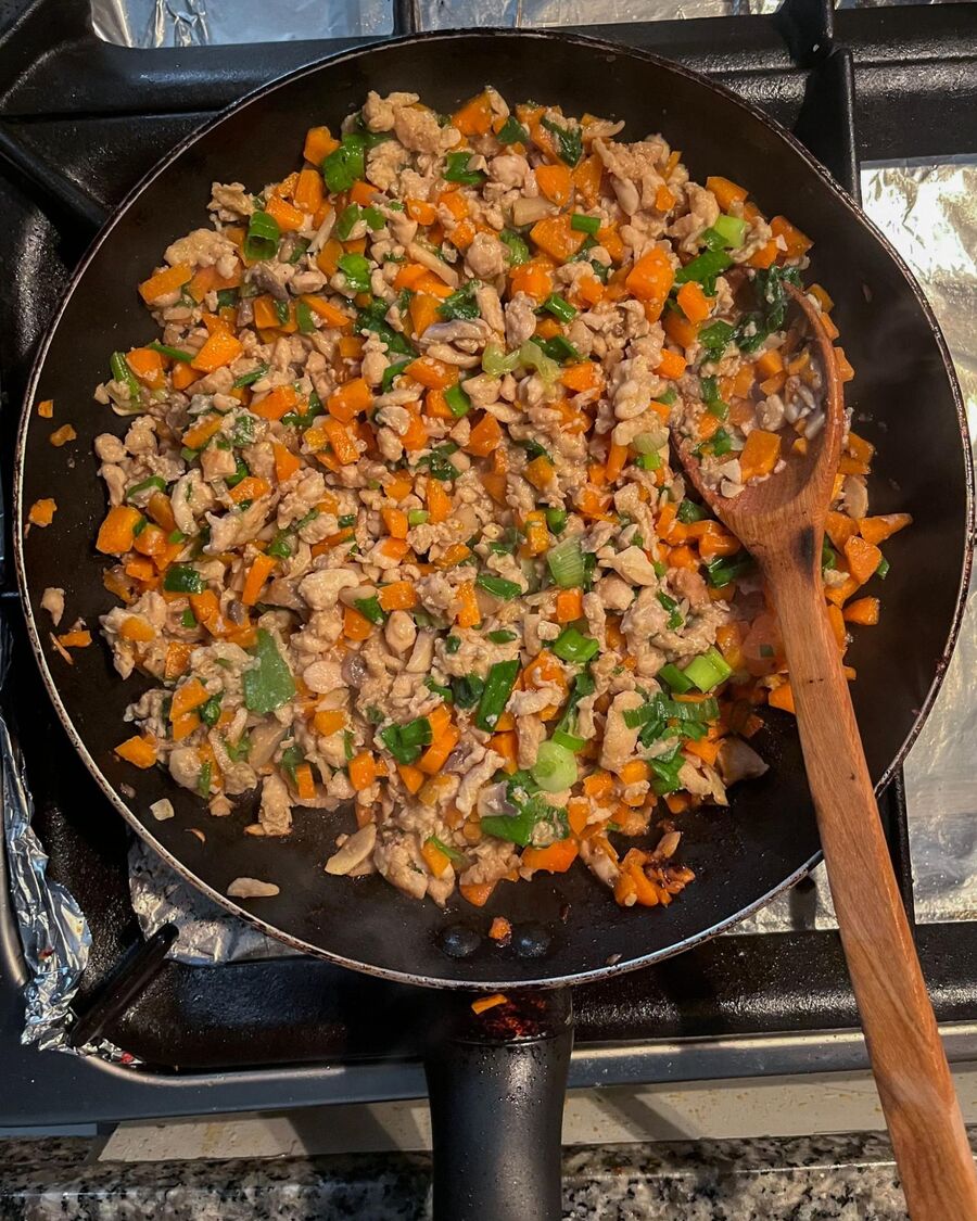 Add the chopped spring onion and stir to combine. Reduce the heat and allow the filling to cool to room temperature for about 10 minutes or until it is no longer hot.