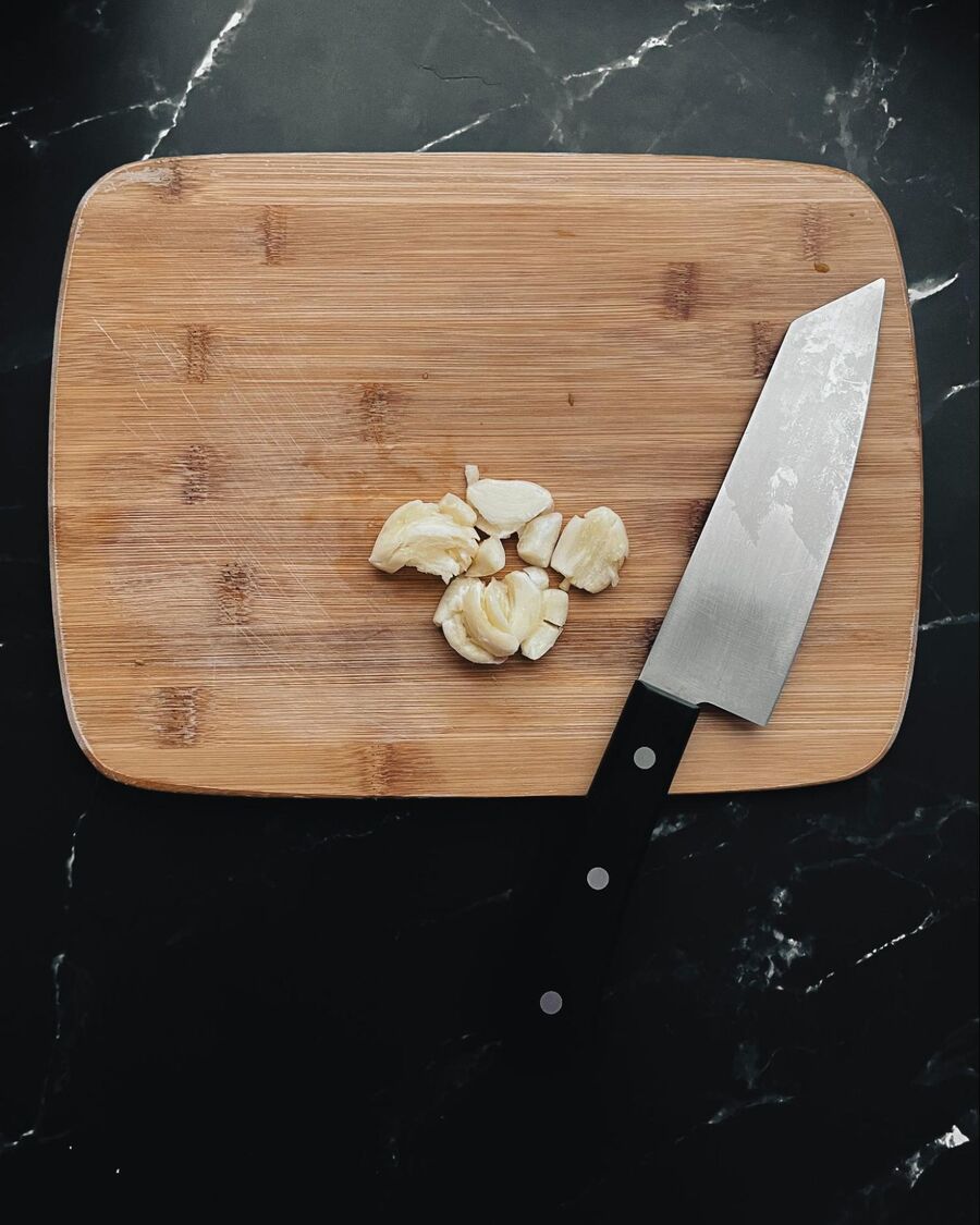 Place 10 garlic cloves in a food processor, or you can mince them with a knife if you prefer.