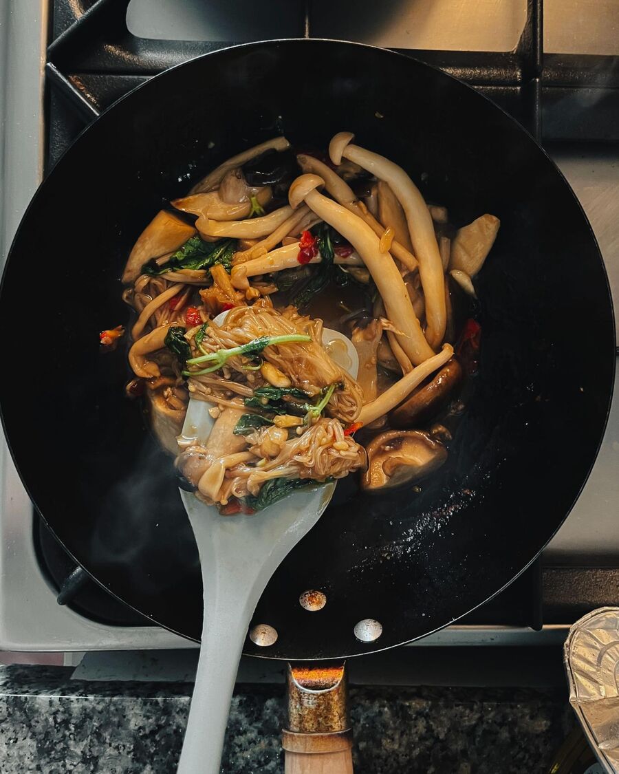Continue to stir for about 30 seconds, making sure the basil leaves are evenly distributed throughout the mixture.