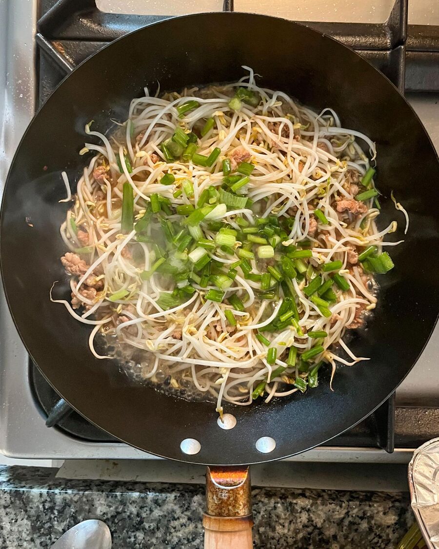 Sprinkle the chopped green onion over the dish.