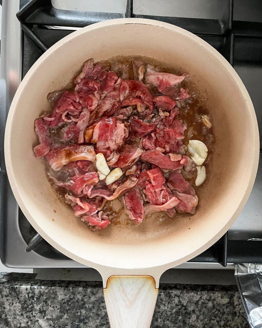 Place a wok or pan over medium-high heat. Once hot, add the marinated beef and stir for about a minute to combine.