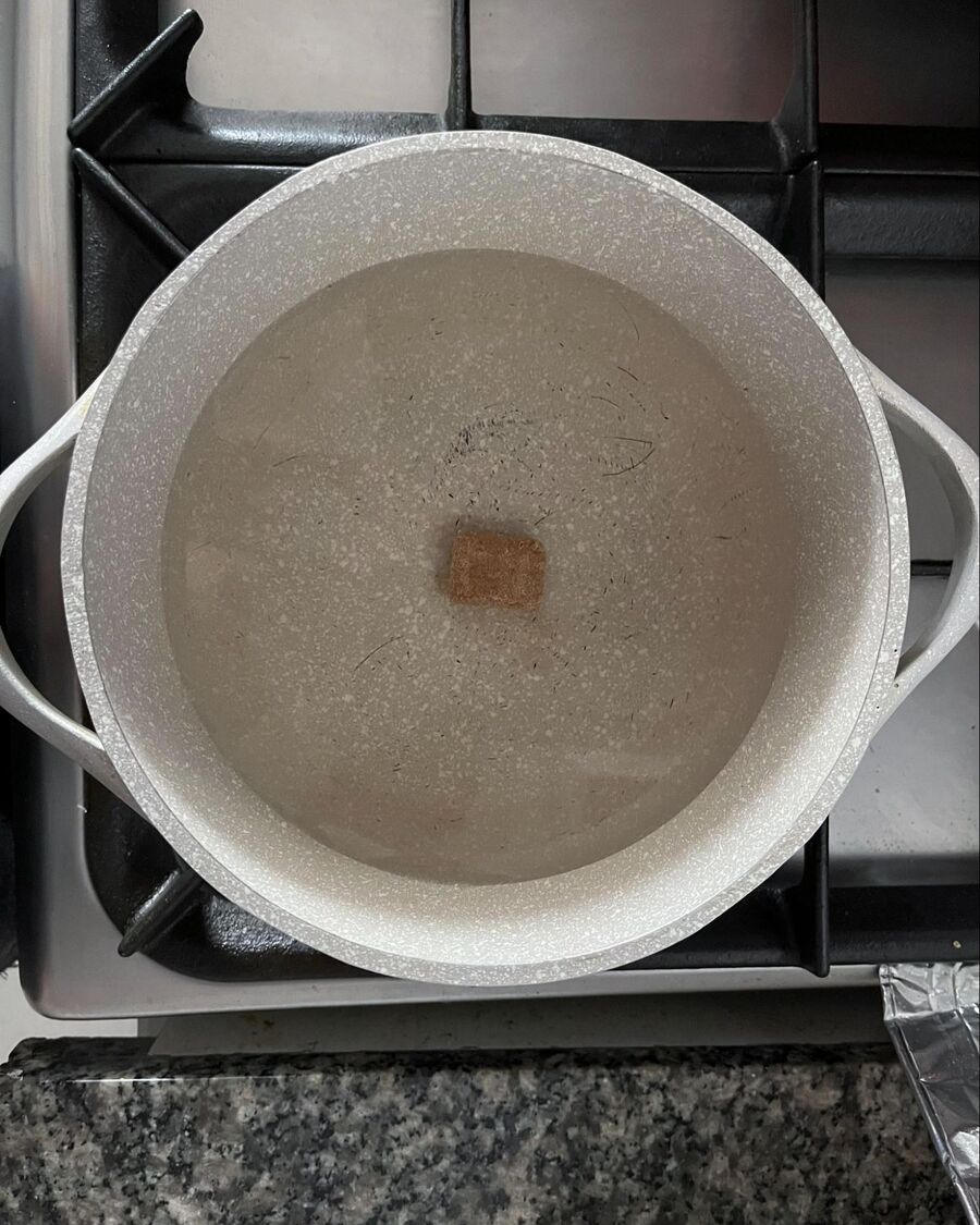Place a pot on the stove over medium-high heat and add 3 cups of water. Drop in a pork broth cube and wait for the water to come to a boil.  
