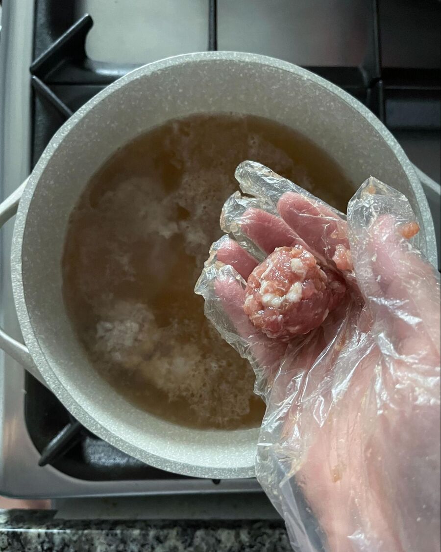Add the meatballs to the pot and cook until they are fully cooked through.