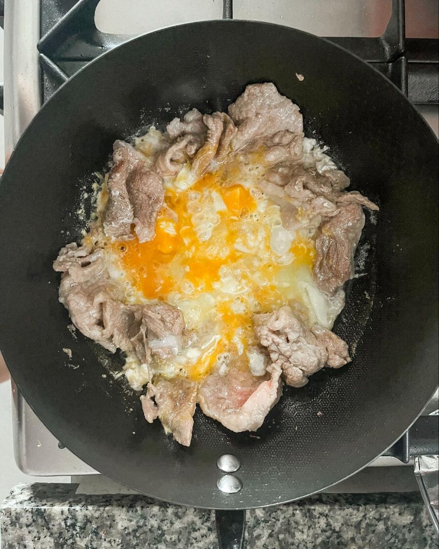 Crack the eggs directly into the meat and scramble to combine. Cook until the meat is fully cooked and the eggs are set.