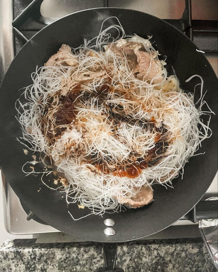 Add the noodles and sauces to the pan with the meat. Toss quickly for about 3 minutes, until the noodles are coated in the sauce and you begin to smell a slight caramelization.