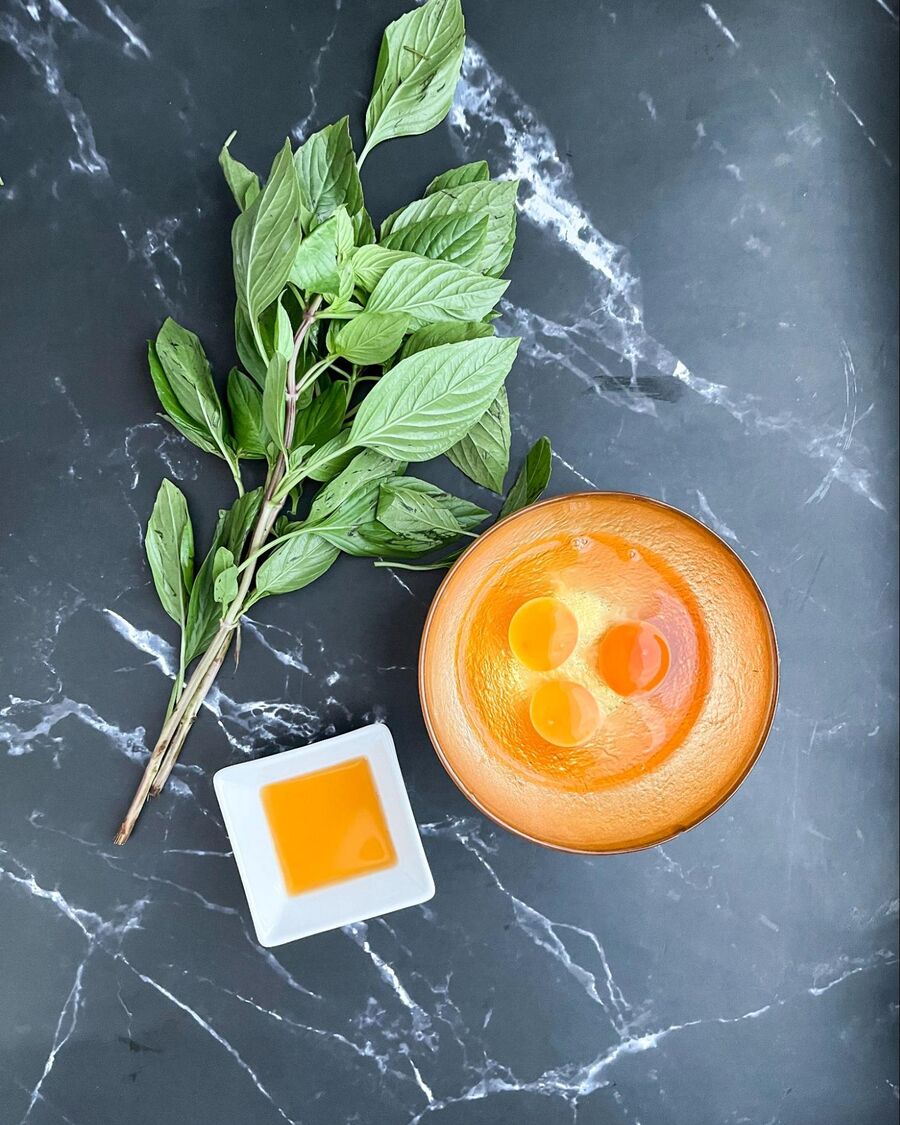 Start by gathering all the essential ingredients for the Thai omelet with sweet basil.